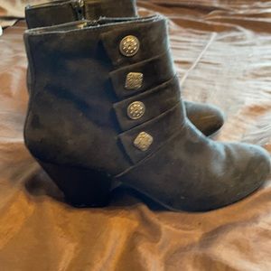 Woman’s black suede heeled booties